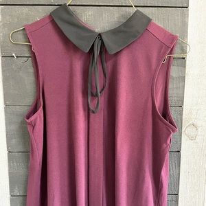 Sleeveless collared top. Elle Brand new washed but never worn. Wine in color